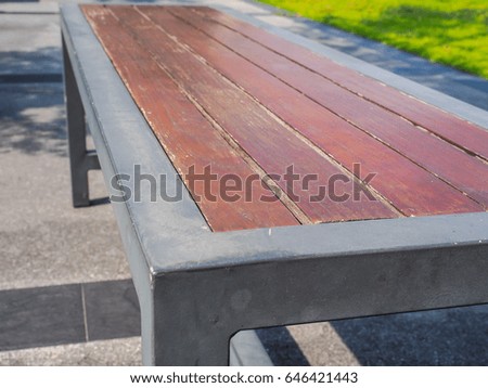 wood with iron bench in the park