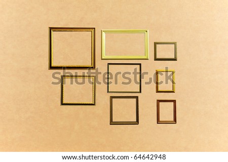 Blank wood frames on brown texture