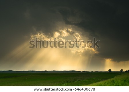 Sun Rays Through the Storm Royalty-Free Stock Photo #646430698