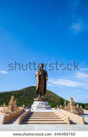 big buddha in wat Thipsukhontharam temple Kanchanaburi thailand on blue sky background