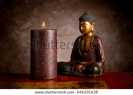 buddha with candle