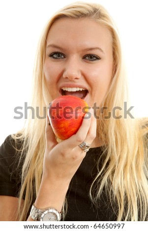 healthy lifestyle: portrait of young blonde woman eating delicious apple over white background