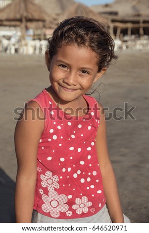 Smiling portrait of cute girl
Candid picture of a Mexican little girl
