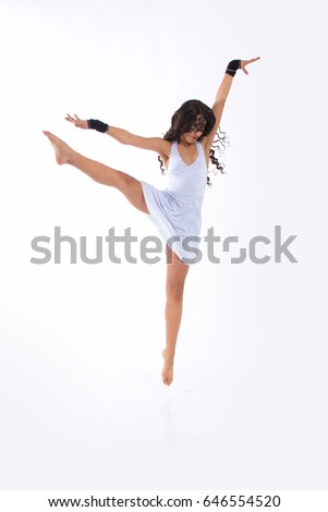 Dancer girl brunette with long hair in white dress dancing contemporary woman in studio on white background