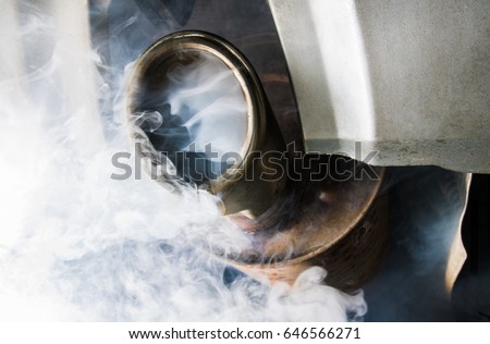 Exhaust gases come from the exhaust system of a diesel engine Royalty-Free Stock Photo #646566271
