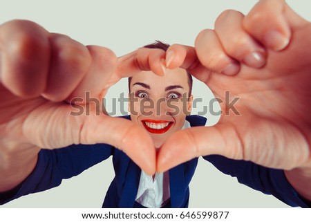 Love. Closeup portrait smiling cheerful happy young pin up woman making heart sign with hands isolated light green wall background Positive human emotion expression feeling life attitude body language