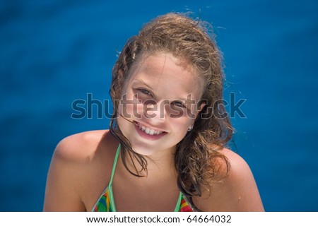 The happy girl against the sea