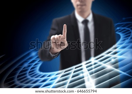 Asian Business man touching technology digital tactile world with his finger concept