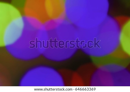 Abstract colorful bokeh blurred lights on a dark background
