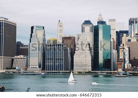 Manhattan skyline background. View from Brooklyn bridge park. Travel, vacation, sightseeing, new york, tourism, and urban living concept
