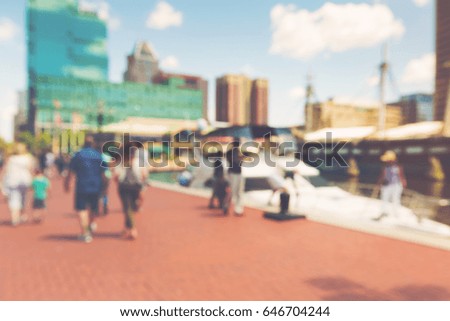 Abstract blurred people walking at the Inner harbor of Baltimore, Maryland