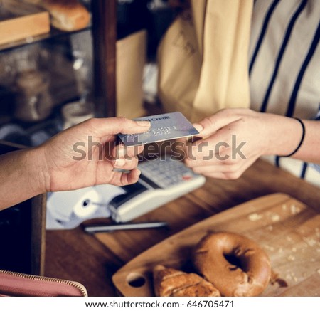 Customer Buying Fresh Baked Bread in Bakery Shop