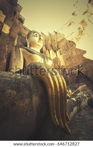 Giant statue of Buddha with retro filter effect in Wat Si Chum At Sukhothai historical Park, Sukhothai province , Thailand  [Vintage Filter] 