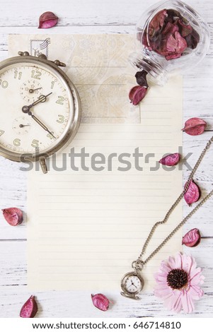 Flat lay stock photography purple flower petals letter envelope paper transparent glass bottle pocket clock