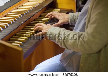 A woman playing piano in christian church