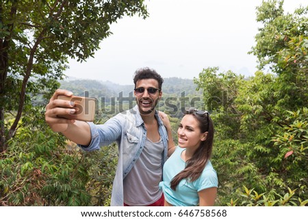 Young Couple Taking Selfie Photo On Cell Smart Phone Over Beautiful Landscape, Man And Woman Happy Smiling Tourists On Hike