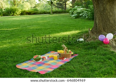 Picnic wth fruits under a tree