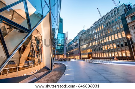 Skyward view of London City skyscrapers at twilight - UK. Royalty-Free Stock Photo #646806031