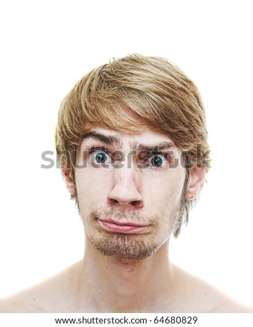 A young man caught in a dilemma looking into the camera with a confused look on his face, isolated on a white background.