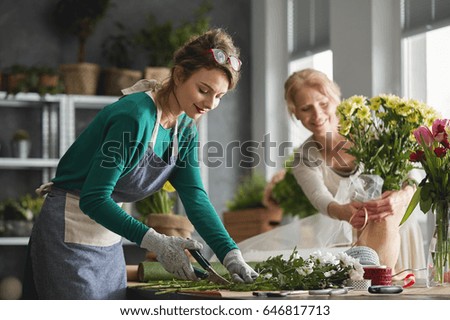 Young woman working in modern flower shop