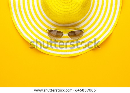 yellow sunglasses and striped retro hat. summer concept Royalty-Free Stock Photo #646839085