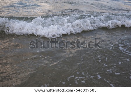 Blue sea waves with a lot of sea foam. Beautiful blue waves with a lot of sea foam scene, close up