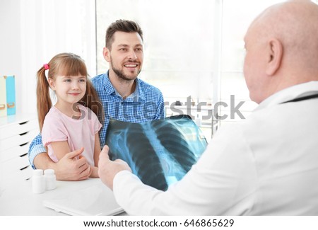 Little girl with father at orthopedist's office