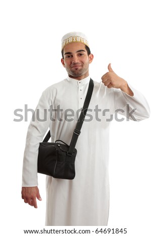 Happy ethnic arab man showing a thumbs up hand sign.  White background. [May be offesive gesture in Middle Eastern Countries and Internationally] Royalty-Free Stock Photo #64691845