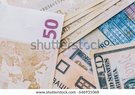 Euro, dollar banknotes and coins on the table