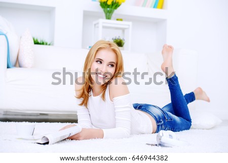 Beautiful happy young woman enjoys her weekend at home. 