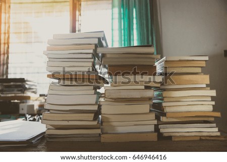 Stack of books on table ,vintage style.