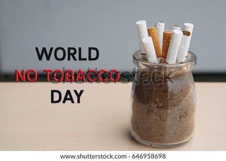 Cigarette butts in ashtray with copy space - May 31st, World No Tobacco Day, No Smoking Day, Stop Smoking Concept and Between tobacco and the health, choose health.