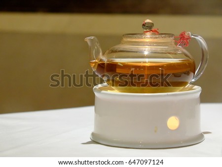 Glass tea pot on a ceramic stove