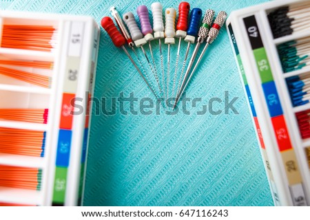 endodontic instruments on the napkin. Top view with copy space for text. Royalty-Free Stock Photo #647116243