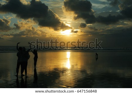 Sunset reflection and people on the sea