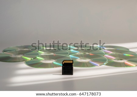 SD-card vs CD-discs on the table