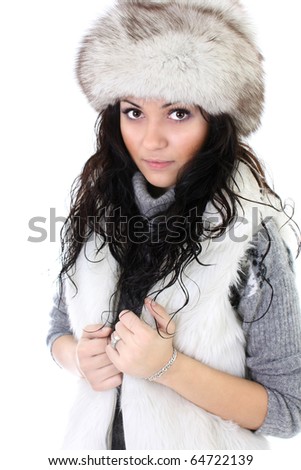 attractive woman in fur hat isolated over white background