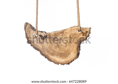 Wooden board on ropes on white isolated background