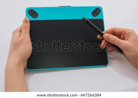 Graphic tablet in hands
