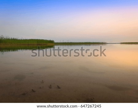 Beautiful nature of the lake resort and soft sunset blue sky