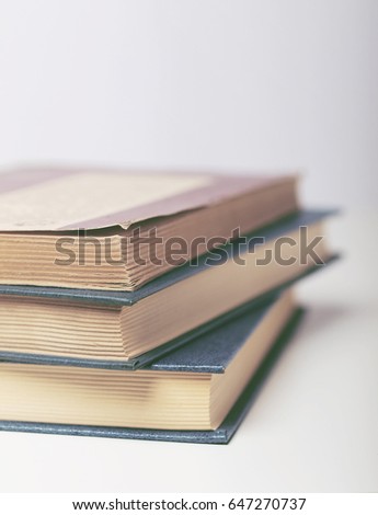 Closeup of old books on white background