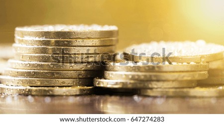 Golden coins closeup - web banner of money savings concept