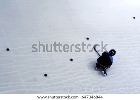Blurred ice skater background.