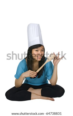 Pretty chinese woman chef wearing chef hat isolated over white background