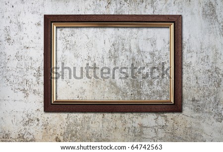 blank photo frame on old wall
