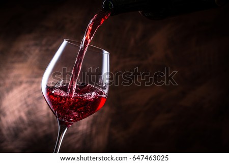Pour red wine Royalty-Free Stock Photo #647463025