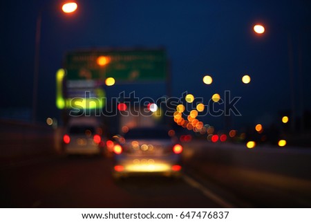A picture of big round bokeh on the road when traffic jam at night.