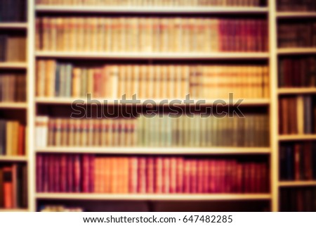 blurred background bookshelf full of books. Concept of library.