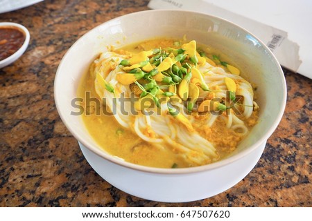 A Bowl of Num Banh Chok, or Traditional Cambodian Rice Noodles Topped with Herbs Royalty-Free Stock Photo #647507620