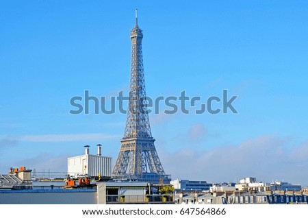 An iconic Eiffel Tower in Paris on a clear morning 